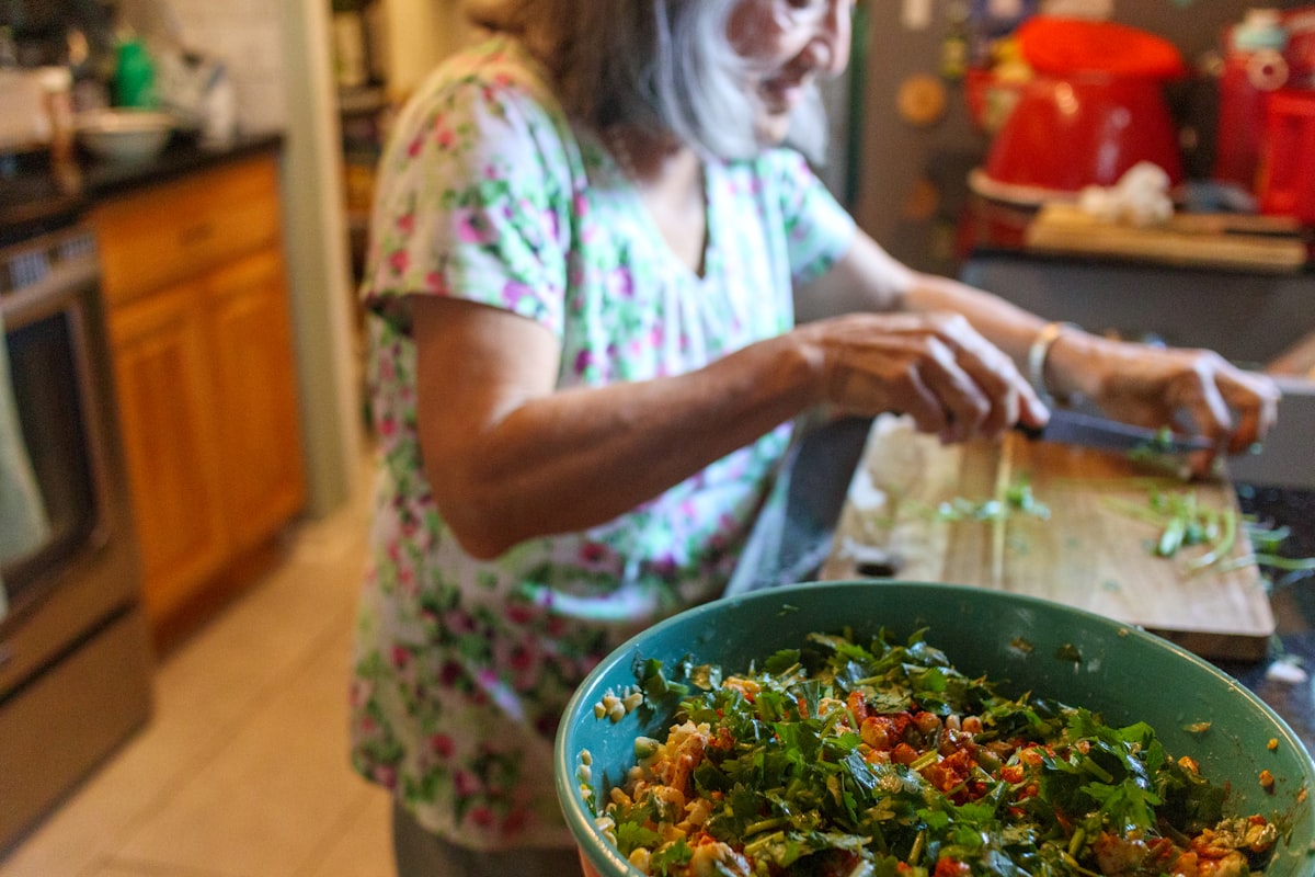 Woman enjoying healthy balanced meal with colorful vegetables and whole grains